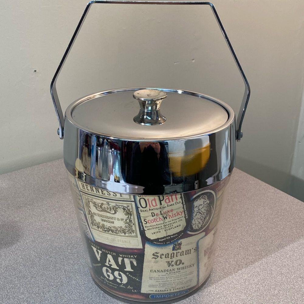 MCM madmen ice bucket with brand name decals.